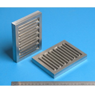 Figure 3. Cold spray deposited SS316 onto aluminium substrate, following machining of the cooling channel grooves