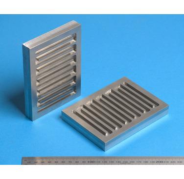 Figure 3. Cold spray deposited SS316 onto aluminium substrate, following machining of the cooling channel grooves