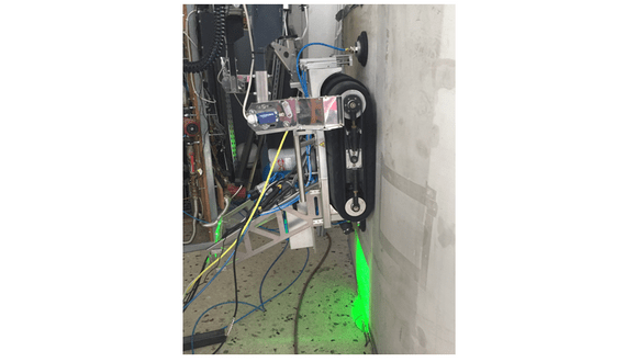 Figure 1. SheaRIOS blade crawling robot performing shearographic inspection on a section of wind turbine blade