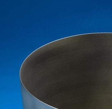 Figure 2: Inconel 718 rocket nozzle, standing 420 mm tall with a wall thickness of 1.3mm. Photographed in the as-built condition (the part was subjected to a light bead blasting to remove excess powder).